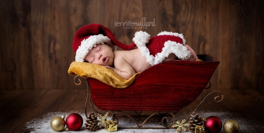 newborn in santa outfit and sleigh christmas fine art