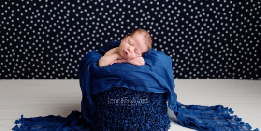 newborn boy in bucket in blue