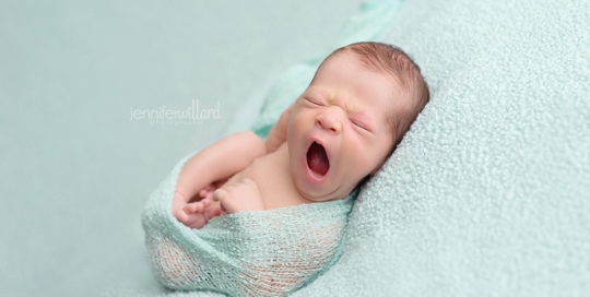 newborn on blue blanket