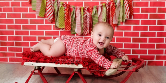 baby boy on sleigh christmas portrait photography