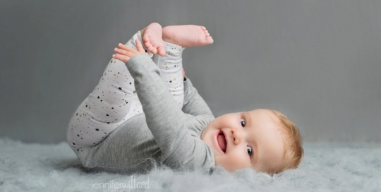 baby girl first year portraits on grey blanket