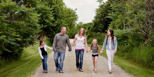 Family portrait walking holding hands