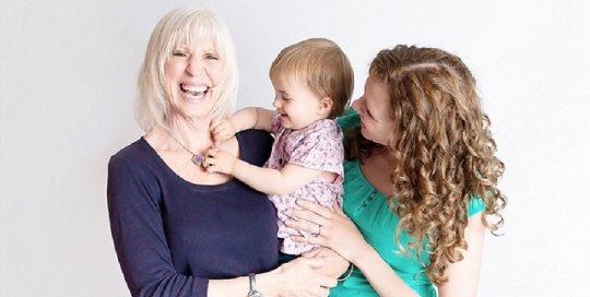 three generation family studio portrait