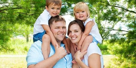 children on parents shoulder