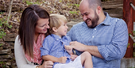 parents tickling son