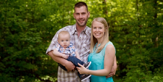 family of three with baby park portrait