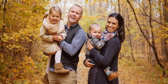 parents with two young children portrait in fall