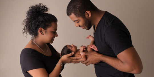 African American father mother newborn girl Kingston baby photographer