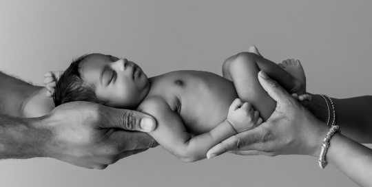 baby girl parents hands up close Kingston newborn photographer