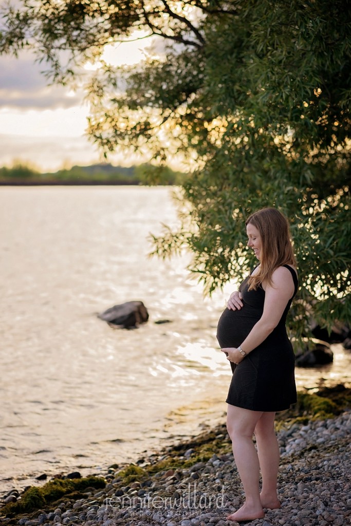 Mom looking down at pregnant belly