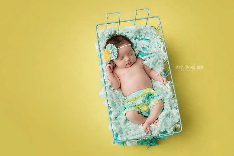 newborn in yellow and blue