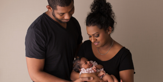 African American mother and father with newborn girl Kingston baby photographer