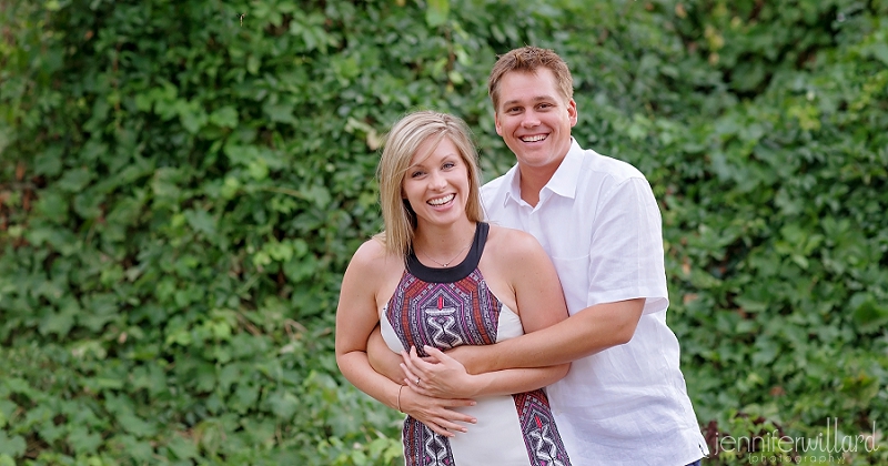 engagement portrait in front of ivy wall