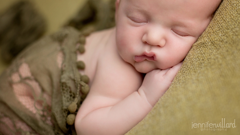 baby portrait on green blanket