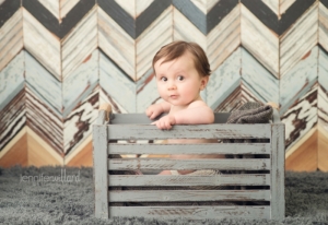 baby picture in crate