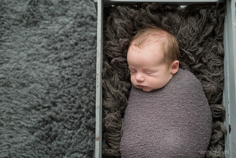 newborn picture in crate