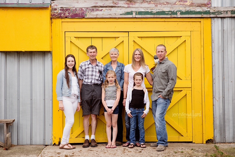 yellow barn with family