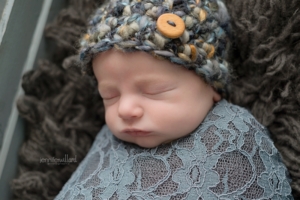 baby portrait in hat and wrap