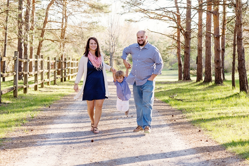 family walking in forest