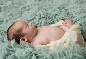 baby pose on blue rug