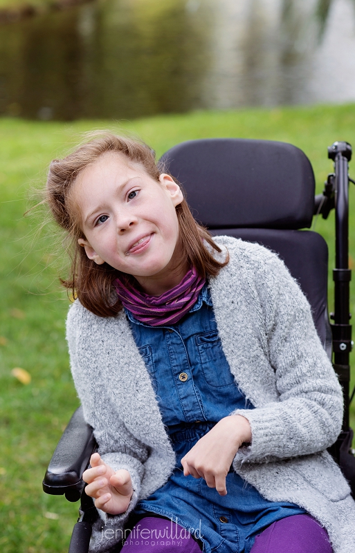 girl in park in wheelchair