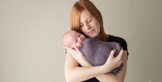 newborn-baby-boy-mother-studio-portrait-cream-backdrop