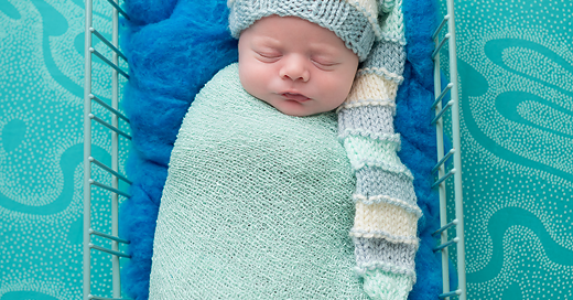 newborn-portraits-blue-blanket-hat-basket-kingston