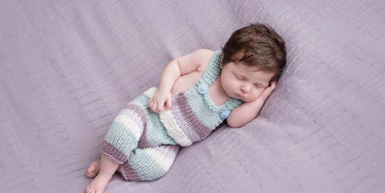 baby-girl-newborn-photography-purple-blanket-overalls