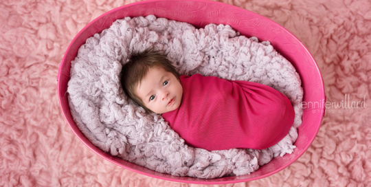 baby-girl-pink-wrap-purple-fur-pink-rug-basket-ygk-photographer