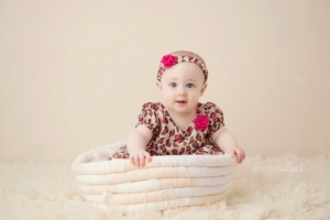 baby-milestone-6-months-old-cream-white-animal-print-portrait