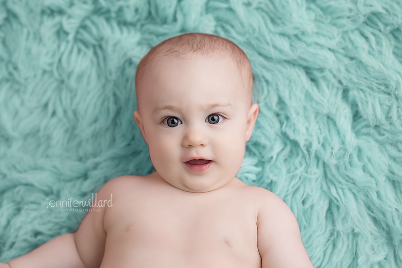 blue-rug-baby-girl-laying-down-milestone-photography-kingston-studio