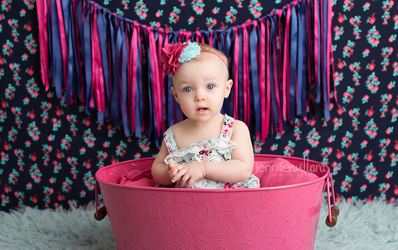 baby-vibrant-colour-portrait-girl-pink-bucket-blue-rug-backdrop-kingston-ontario-portrait-studio