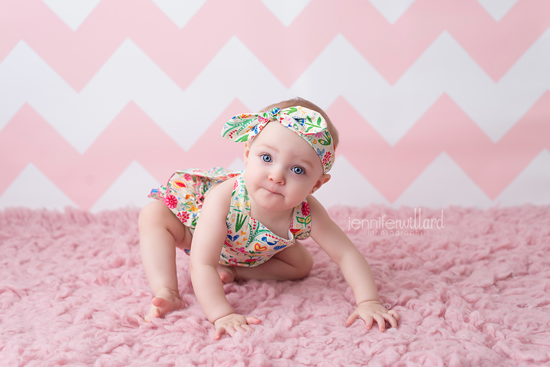 first-year-milestone-baby-portraits-pink-rug-backdrop-romper-kingston-ontario