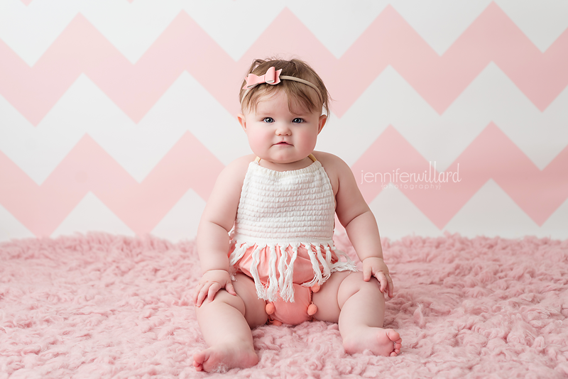 baby-girl-pink-rug-backdrop-spring-romper-headband-kingston-ontario-photography