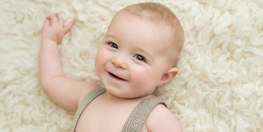 baby-portrait-cream-backdrop-suspenders-kingston-photographer