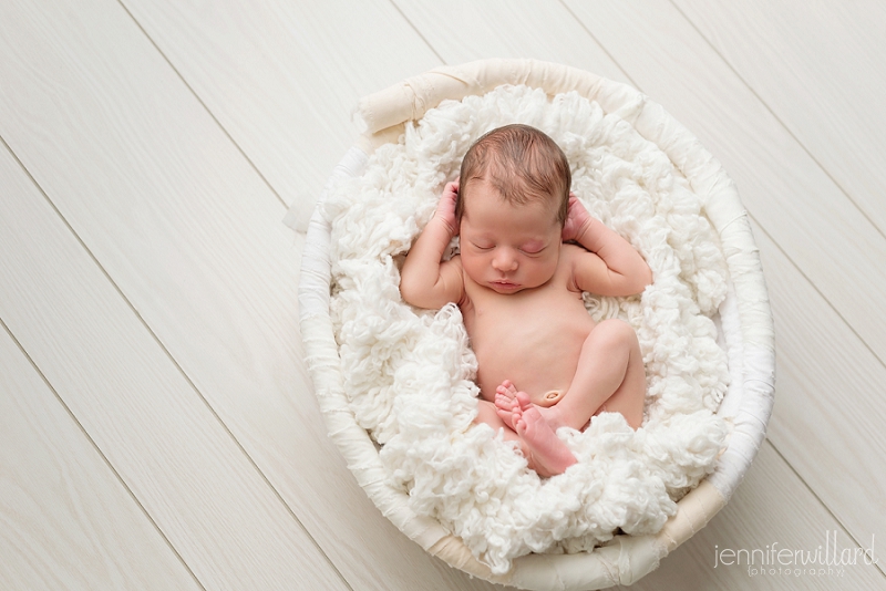 newborn-relaxed-pose-white-bucket-white-wood-floor-ygk-photographer