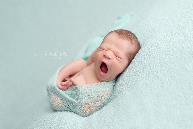 newborn-boy-yawning-blue-blanket-wrap-kingston-portrait-studio