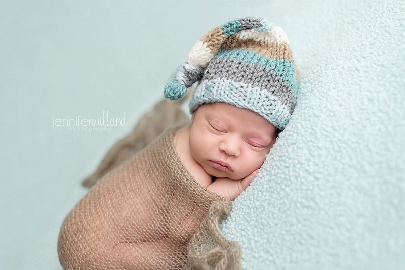 blue-blanket-hat-newborn-baby-boy-pose-studio-portrait