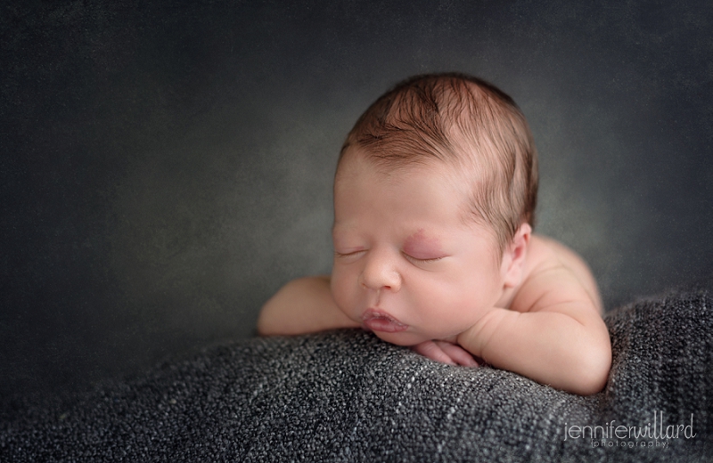 newborn-baby-boy-head-on-hands-pose-grey-blanket-kingston-ontario