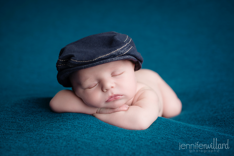 teal-navy-blue-newborn-baby-boy-picture-head-on-hands-kingston-photographer