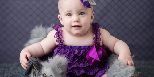 purple-grey-baby-backdrop-purple-romper-grey-flokati-kingston-baby-photographer