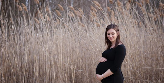 pregnant-mother-black-dress-outdoor-portrait-kingston-ontario