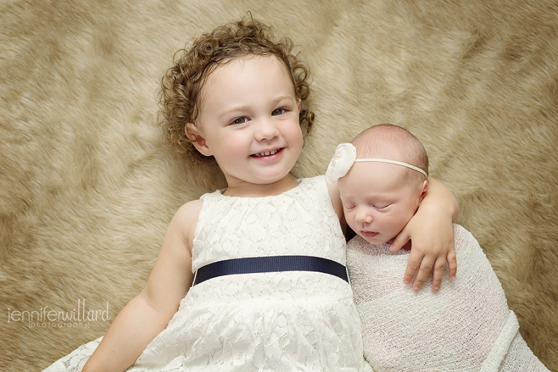 baby-girl-big-sister-sibling-portrait-brown-fur-white-wrap-white-dress-headband-kingston-ontario-photography