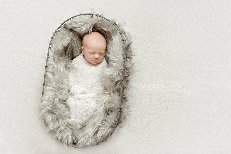 fur-rug-metal-basket-white-backdrop-white-wrap-baby-girl-kingston-portrait-studio