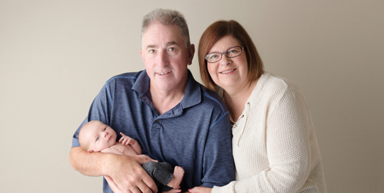 grandparents with grandchild in kingston portrait studio