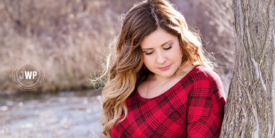 Maternity Portrait of Pregnant Woman in red shirt at Babcock Mill in Odessa Ontario