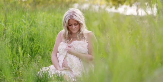 maternity portrait of woman in field at Lemoine Point Kingston Ontario