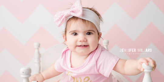 pink chevron backdrop with baby girl in crib at kingston ontario studio