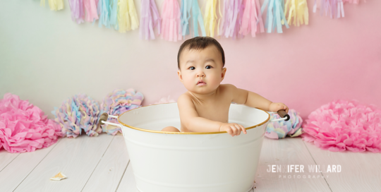 rainbow unicorn birthday portrait after cake smash in tub