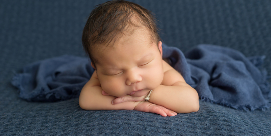 baby boy on blue blanket in kingston portrait studio